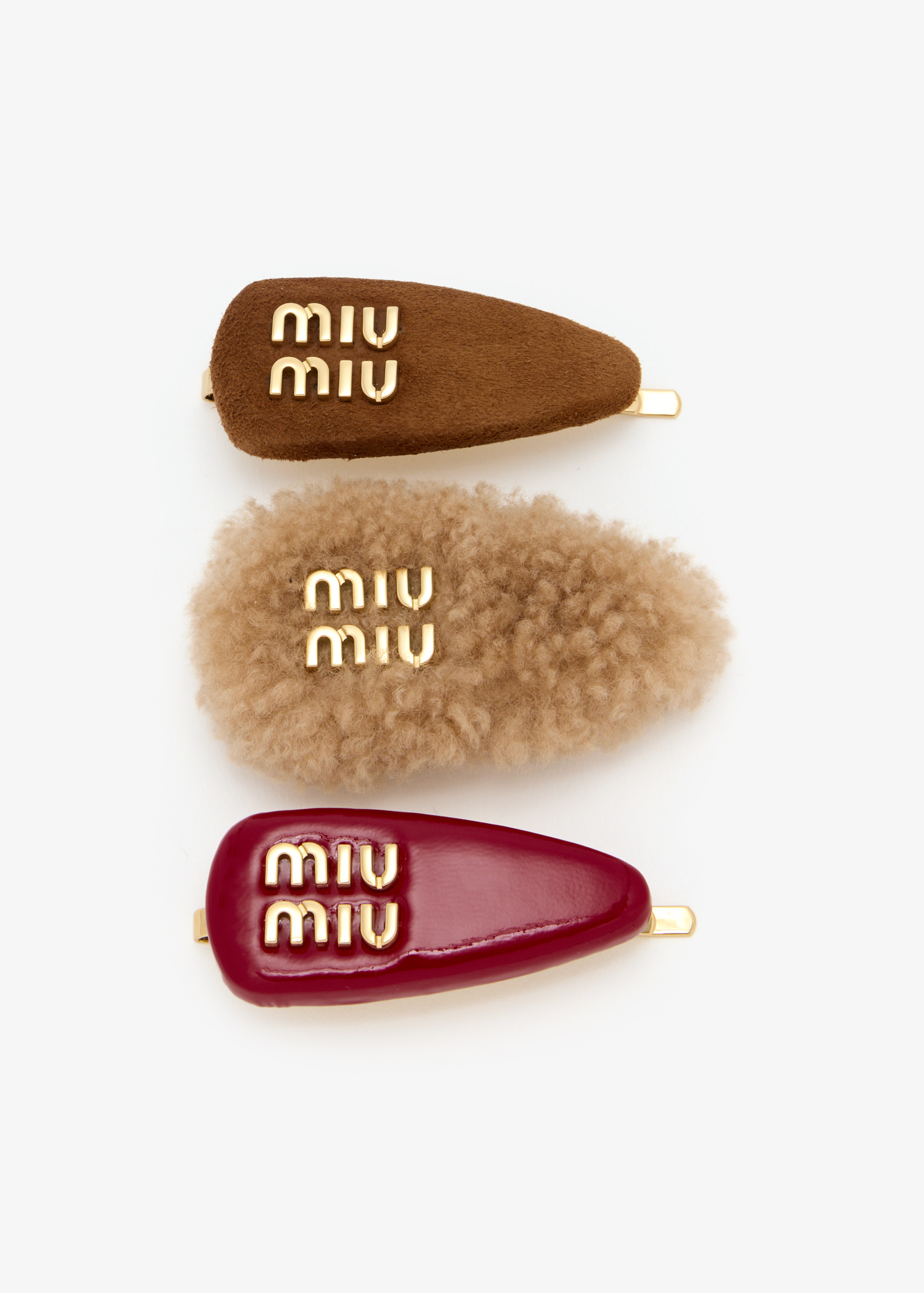 

Set of leather, suede, and shearling hair clips, Brown